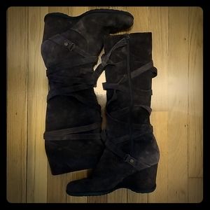 Dark brown suede wedge boots.